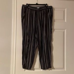 L black lounge pants with Aztec pattern
